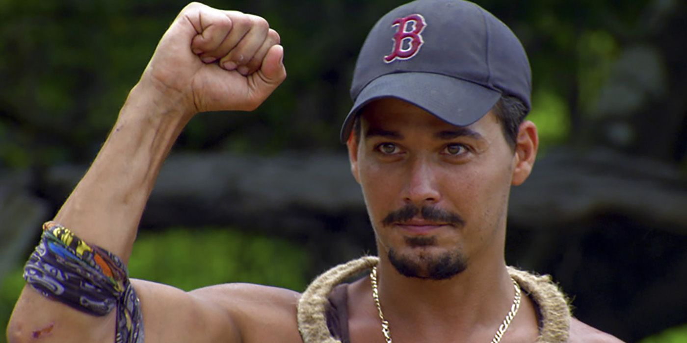 Boson Rob with his fist in the air on Survivor.
