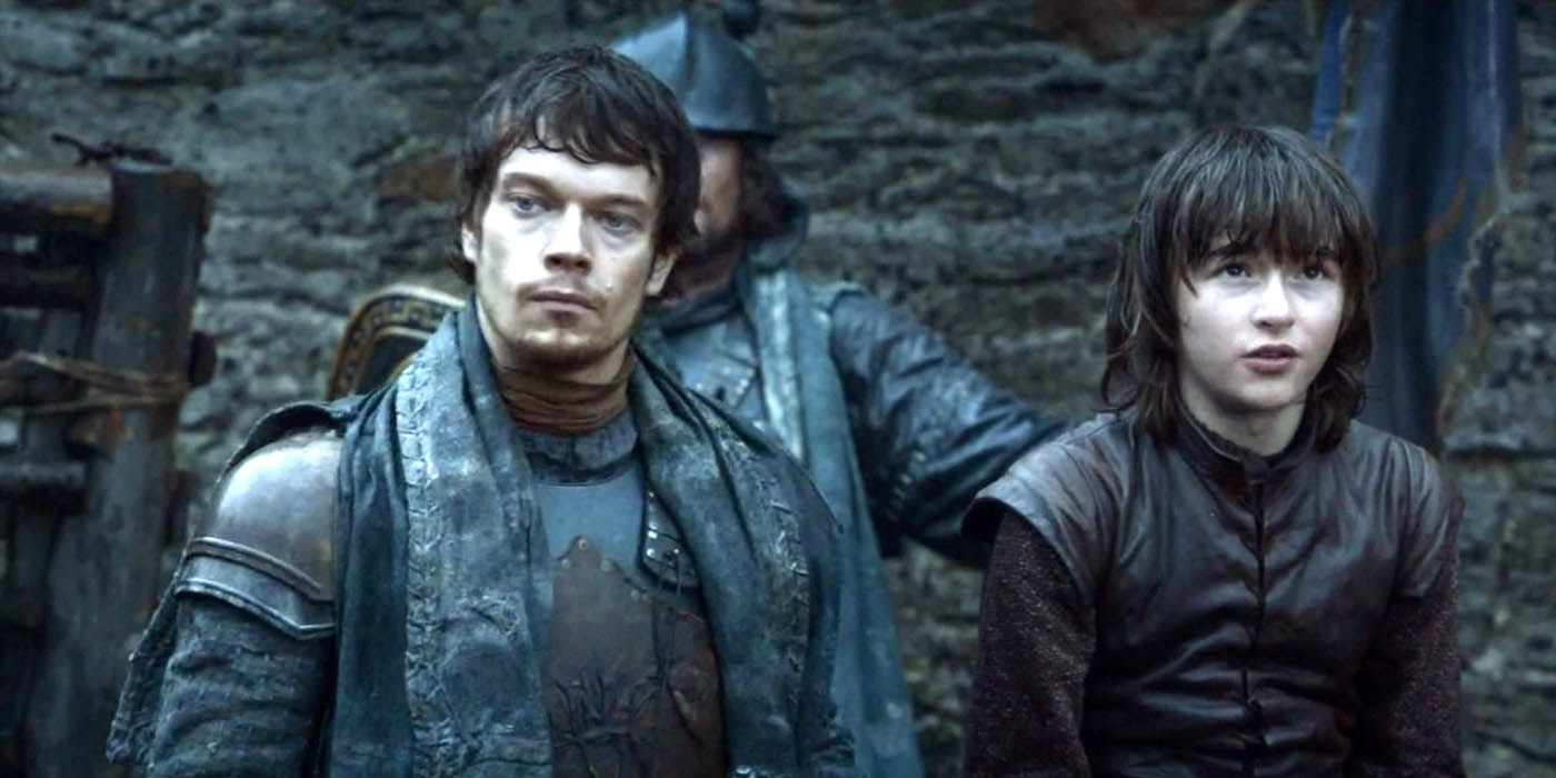 Theon Greyjoy standing with Bran Stark in Winterfell in Game of Thrones