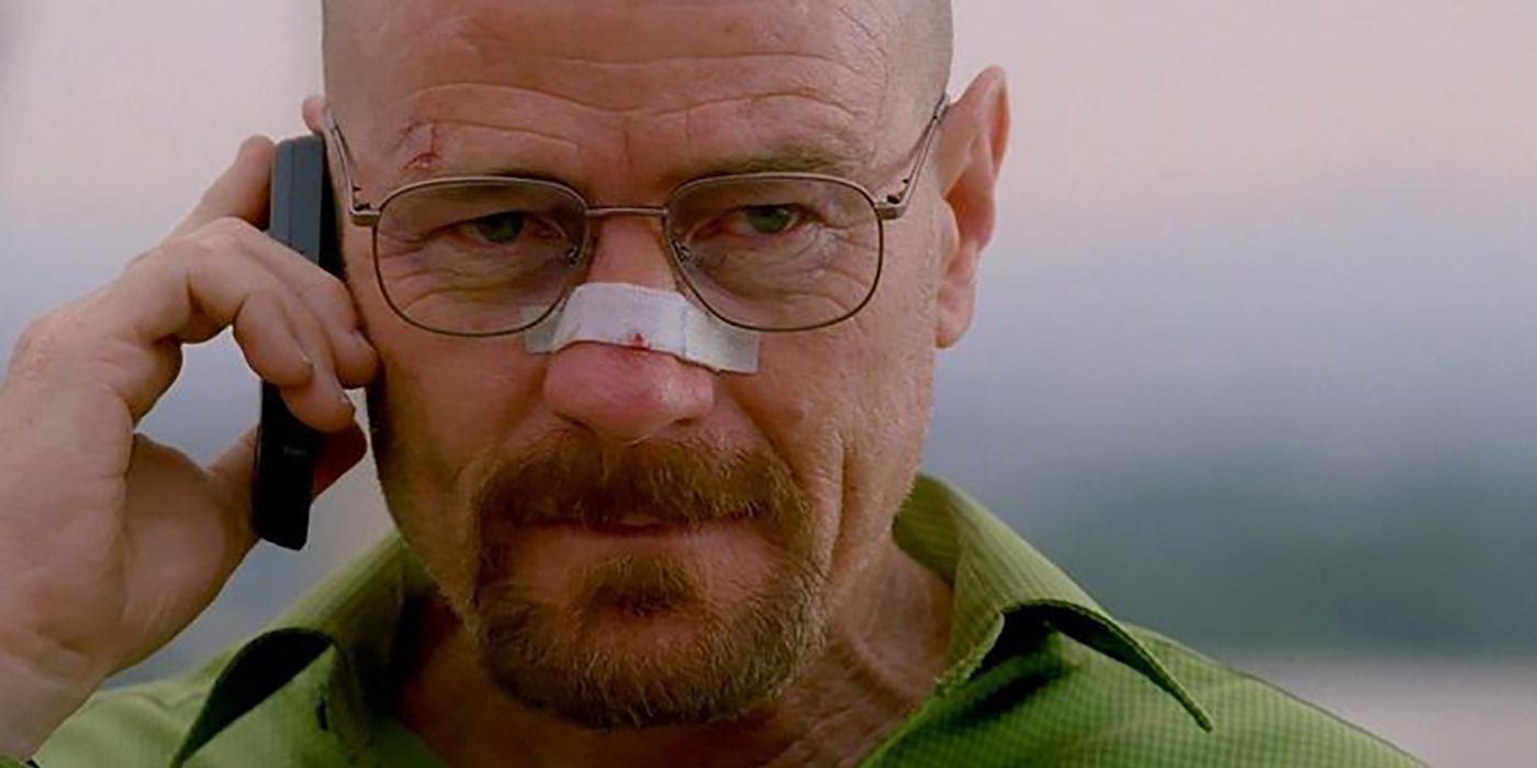 Walter White from Breaking Bad on the phone, a bandage over his nose.