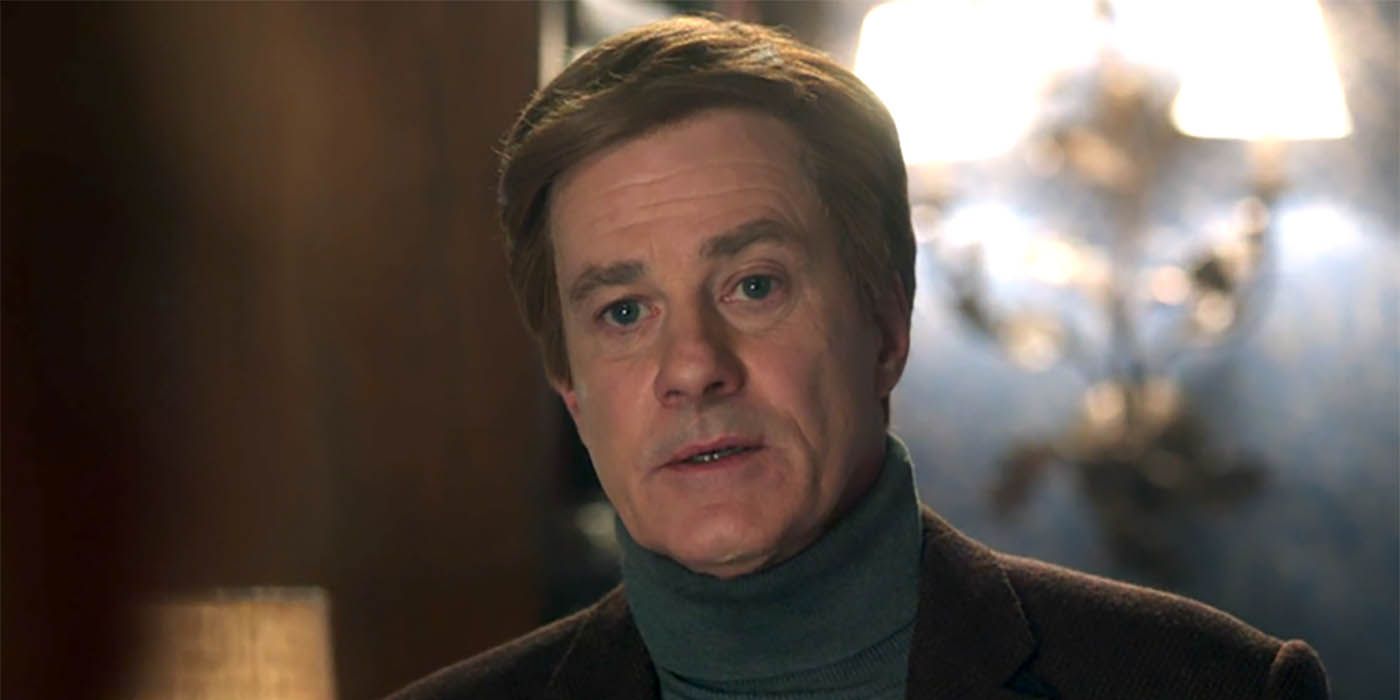 Clifford Blossom from Riverdale, looking ahead wearing a turtleneck.