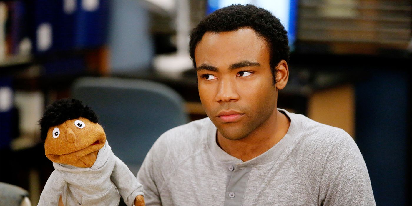 Troy Barnes, Donald Glover in Community with a hand puppet