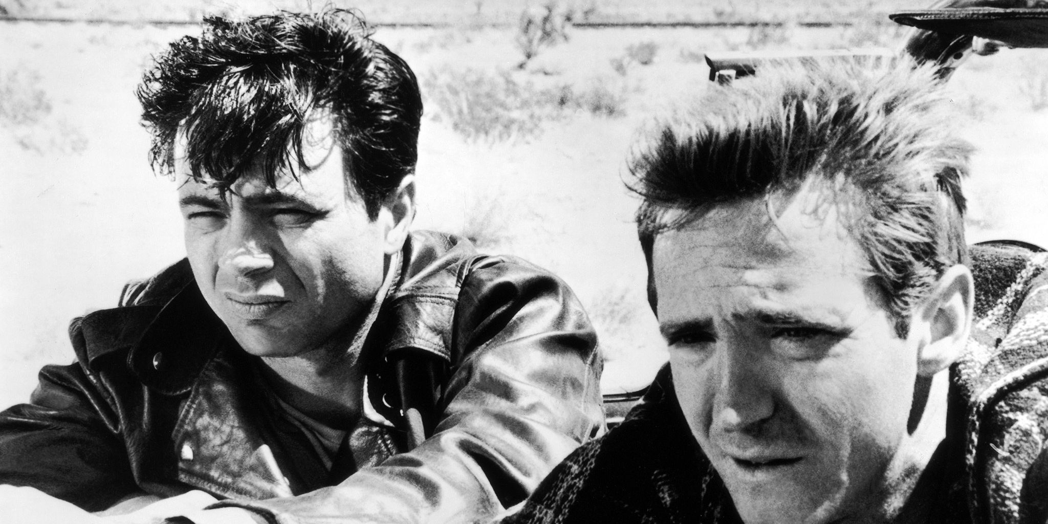 Two men watching intently from the desert in In Cold Blood