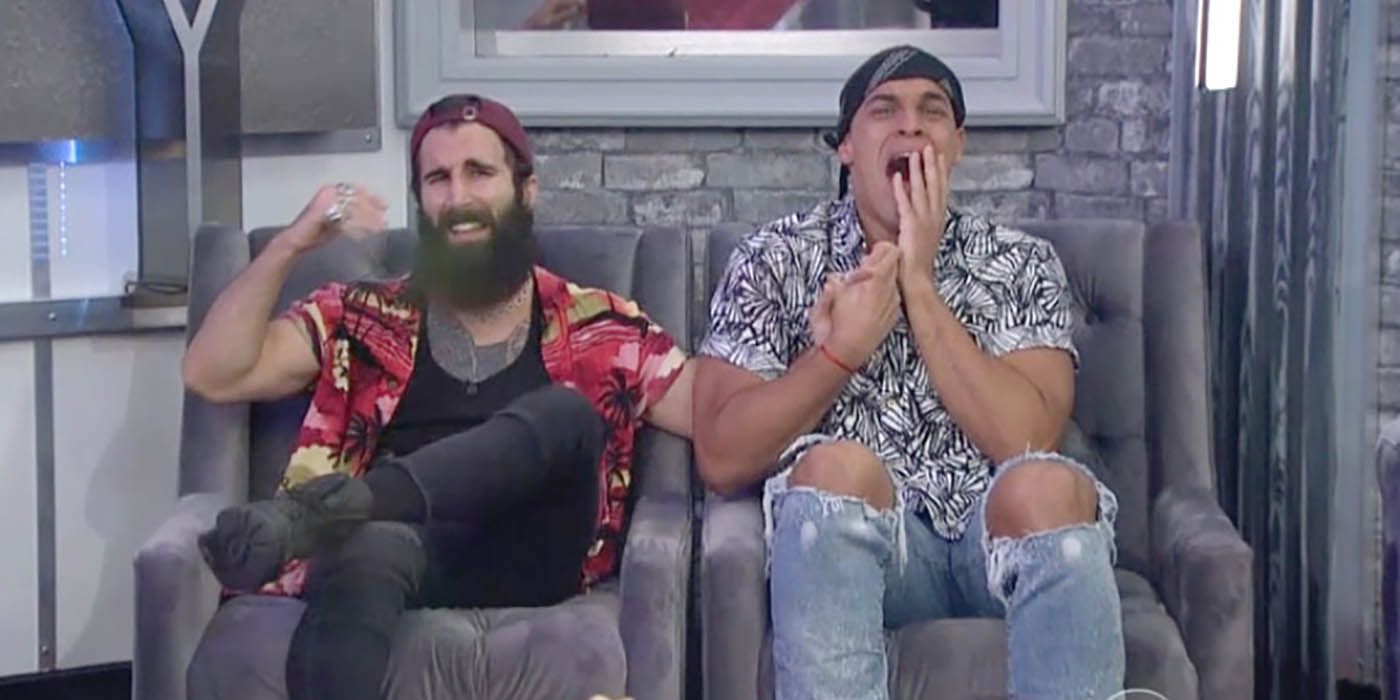 Josh with his hands on his face after beating Paul in the Big Brother finale, Paul's hand up in the air in frustration.