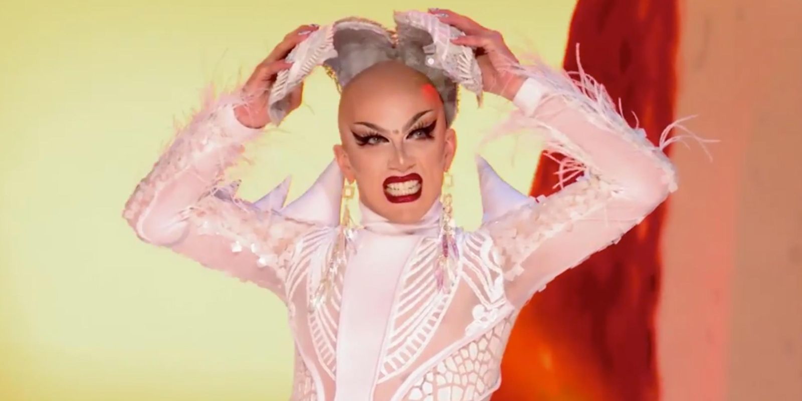 Sasha Velour takes off her mask on the stage in RuPaul's Drag Race.