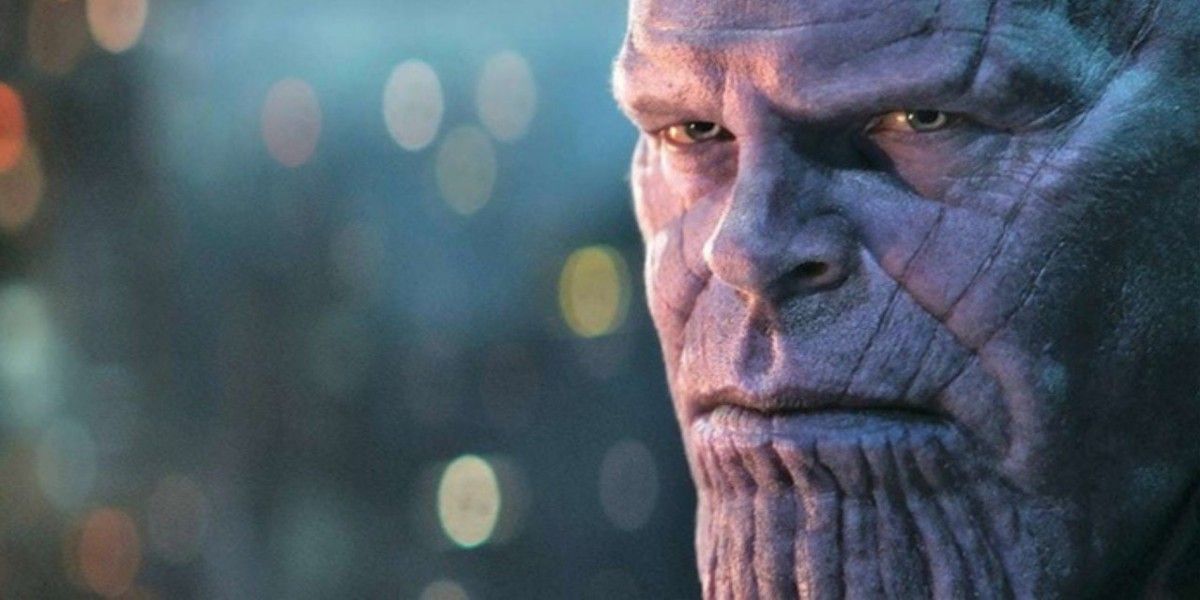 Thanos looking intently with a serious expression on his face