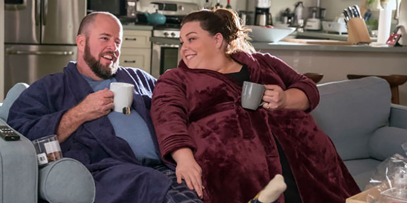Toby and Kate cuddle in their robes with coffee in This Is Us