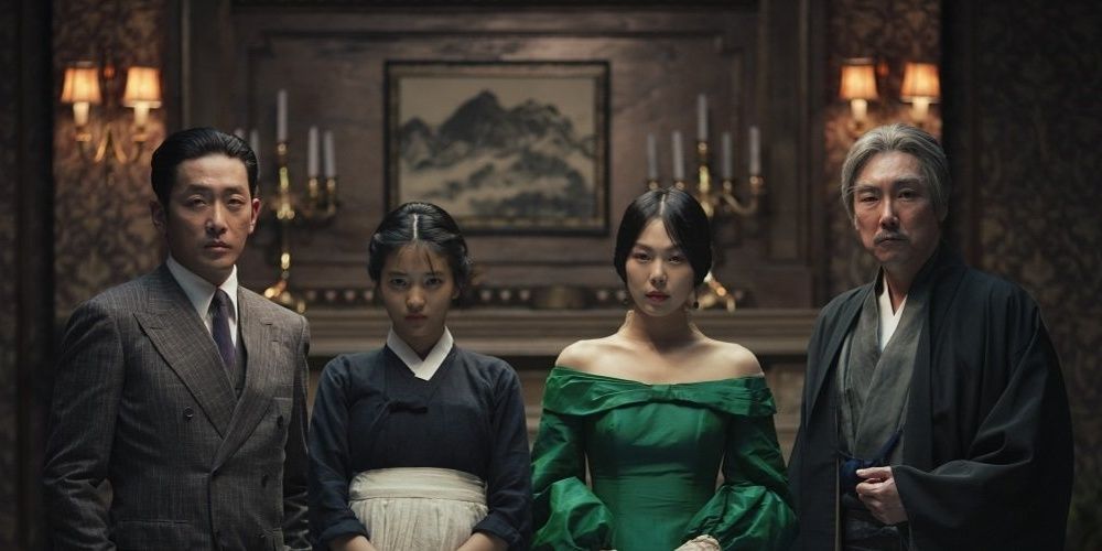 A family posing for a photo in The Handmaiden.