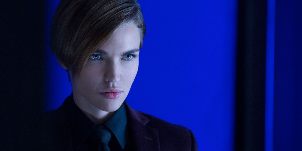 Ares looking off-camera and surrounded by blue in John Wick: Chapter 2
