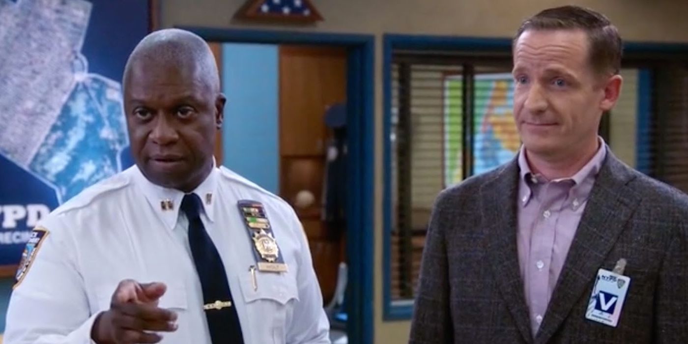 Captain Holt and his husband Kevin on Brooklyn Nine-Nine with Holt pointing towards the camera
