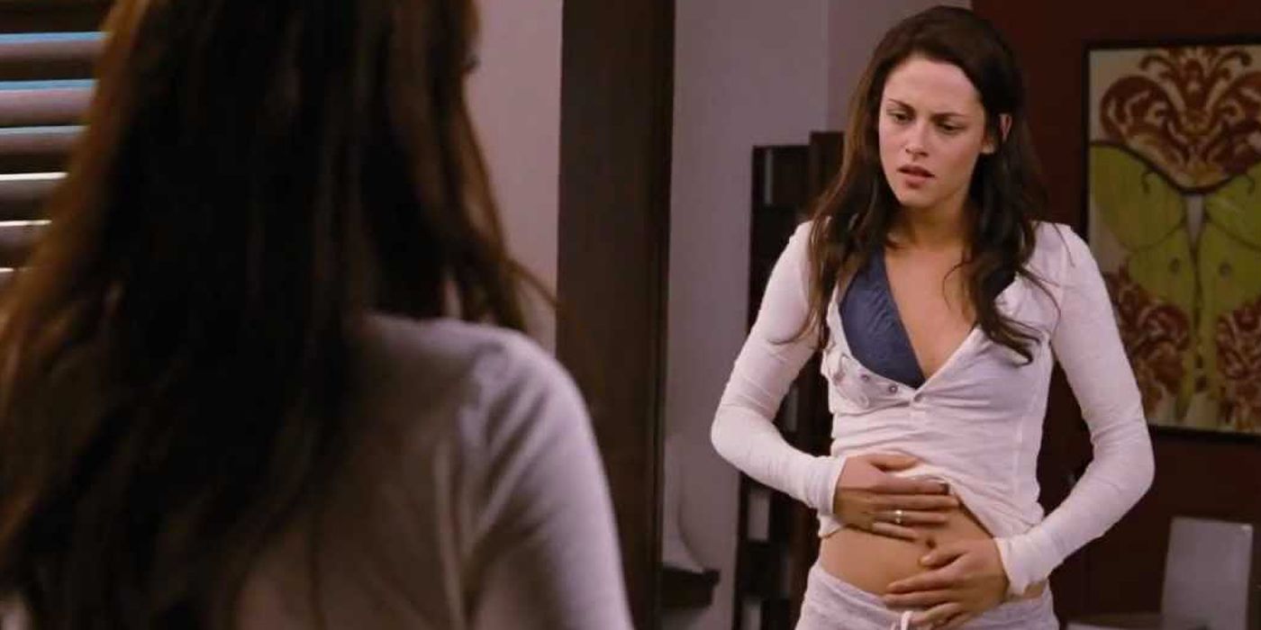 Bella staring at her pregnant stomach in the mirror in Twilight