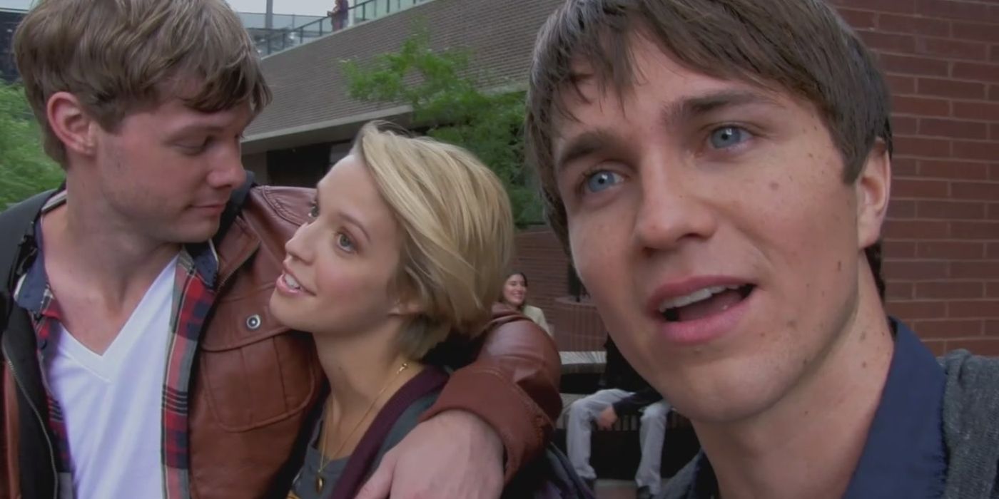 A group of young college students with one looking almost directly into the camera in the Supernatural episode Bitten