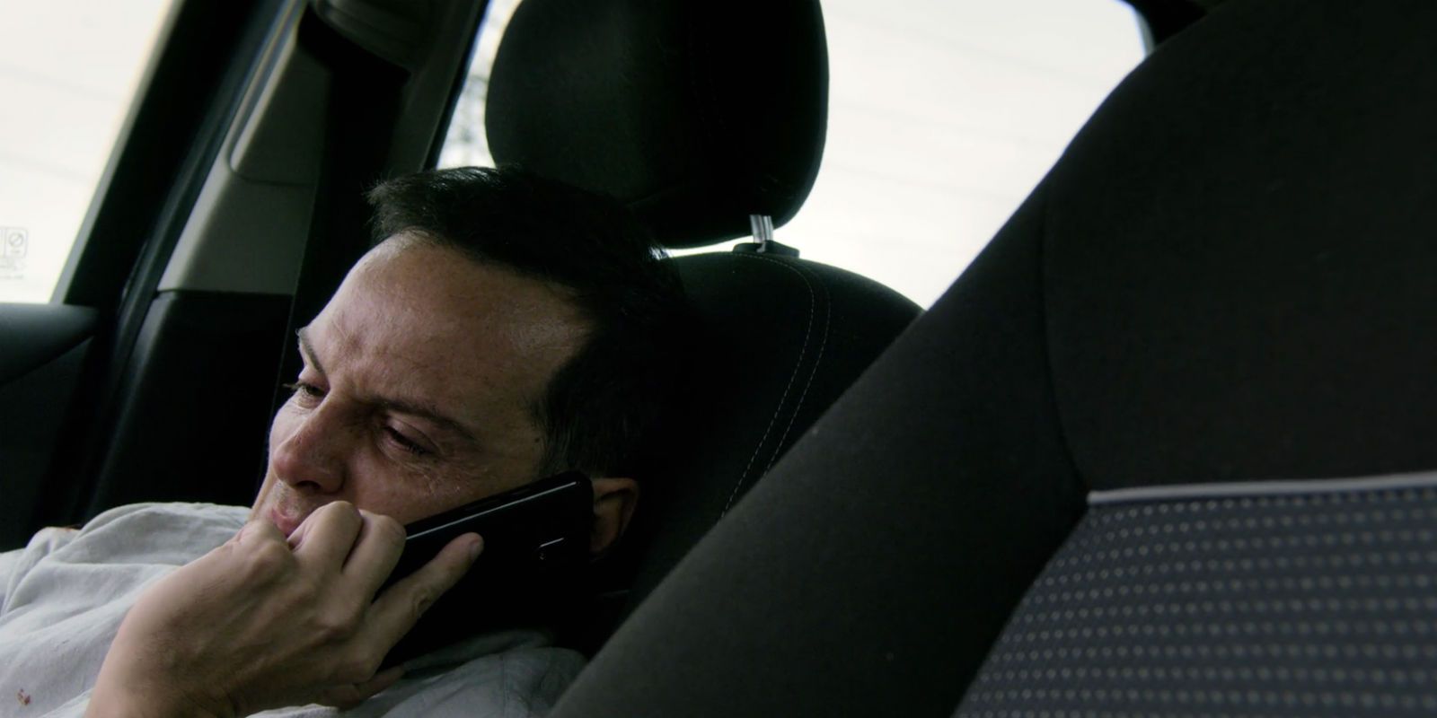 Scott Smithereens on the phone and hiding in the car in Black Mirror