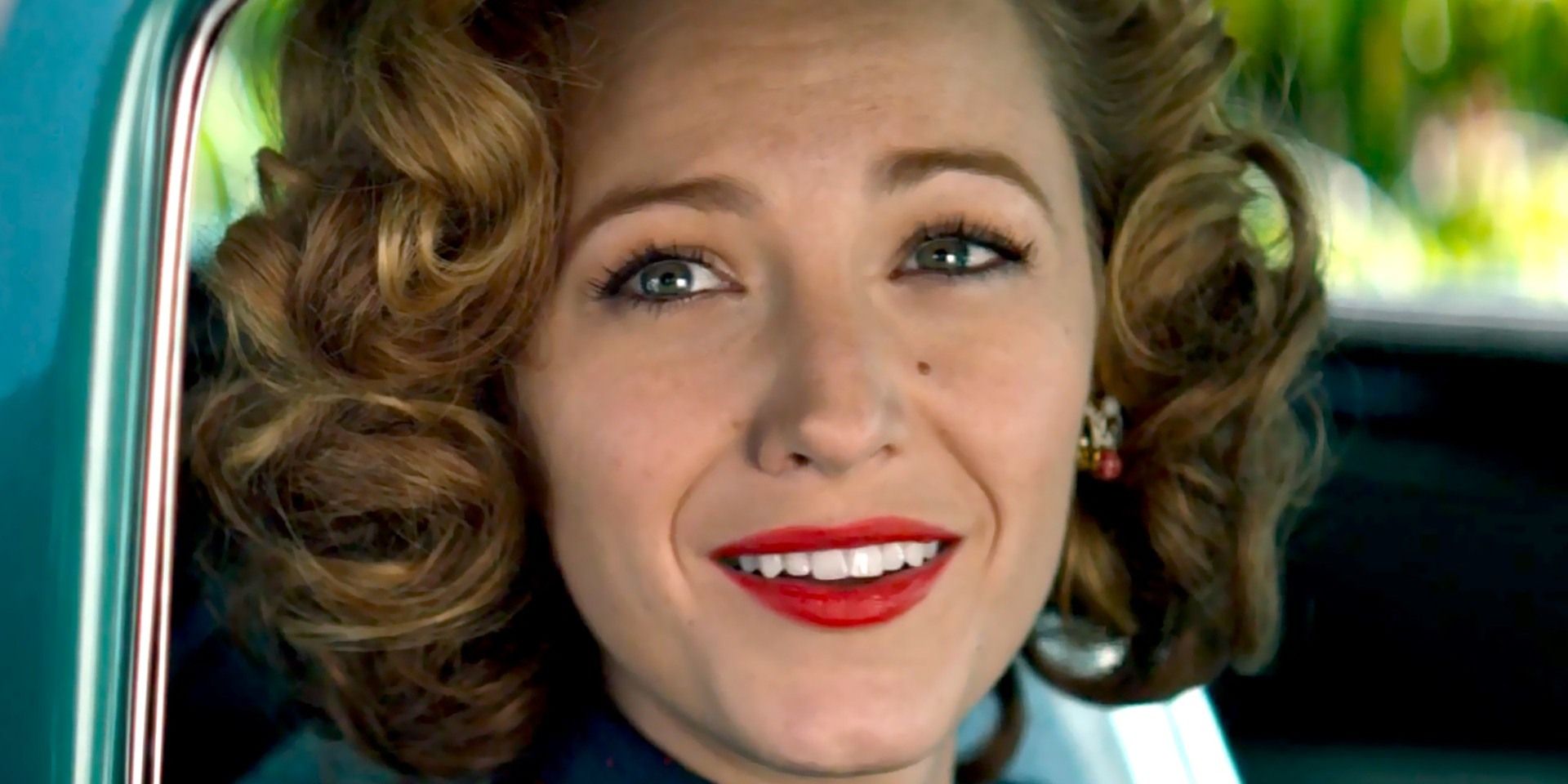 Blake Lively in '40s hair and makeup looks out the car window in The Age of Adaline