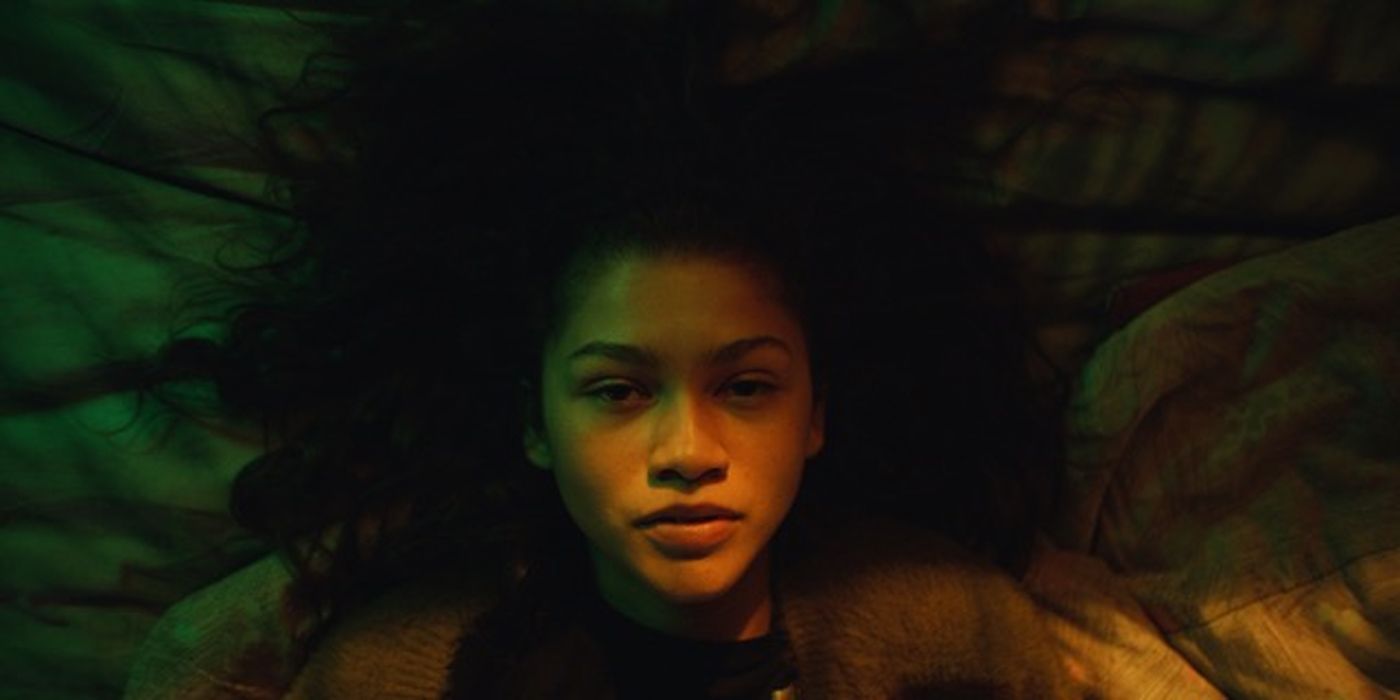 Rue looking up as she lays on her bed in Euphoria.