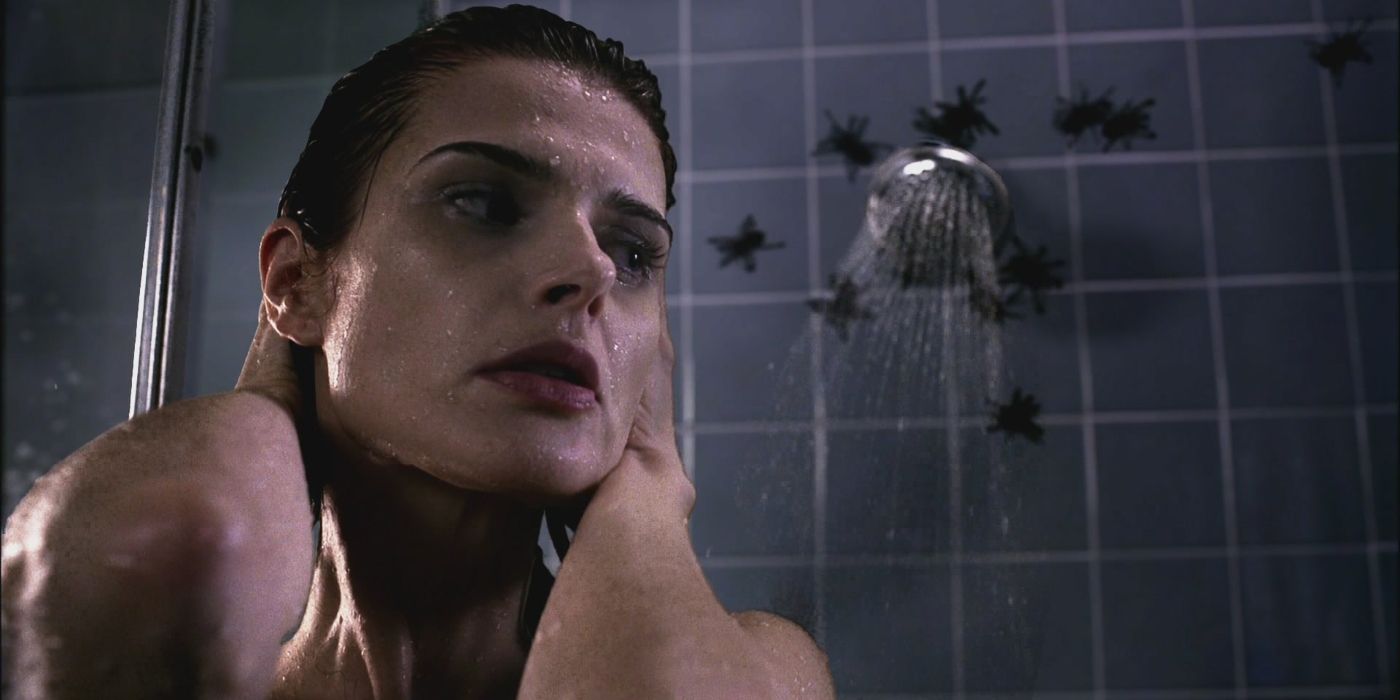 A woman takes a shower while bugs come out of her showerhead in Supernatural