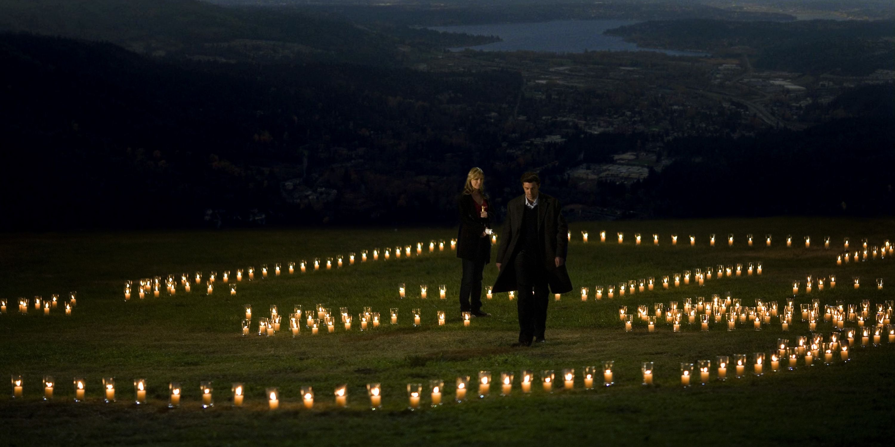 An image of Meredith and Derek standing in a field of candles in Grey's Anatomy
