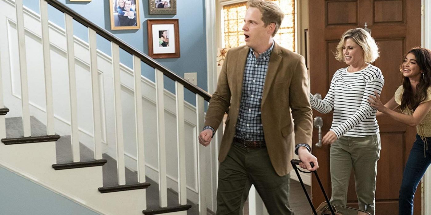 Chris Geere as Arvin with a suitcase in Modern Family