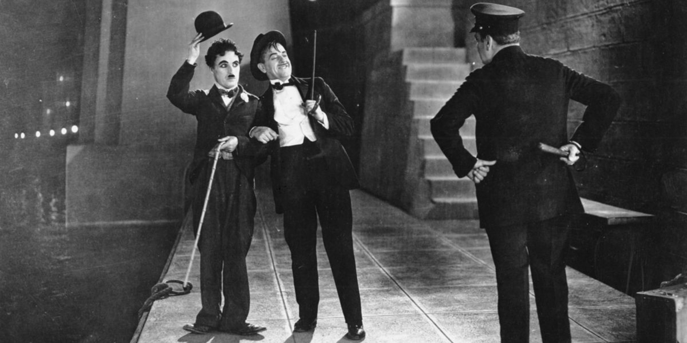 The Tramp lifts his cap to a police officer in City Lights