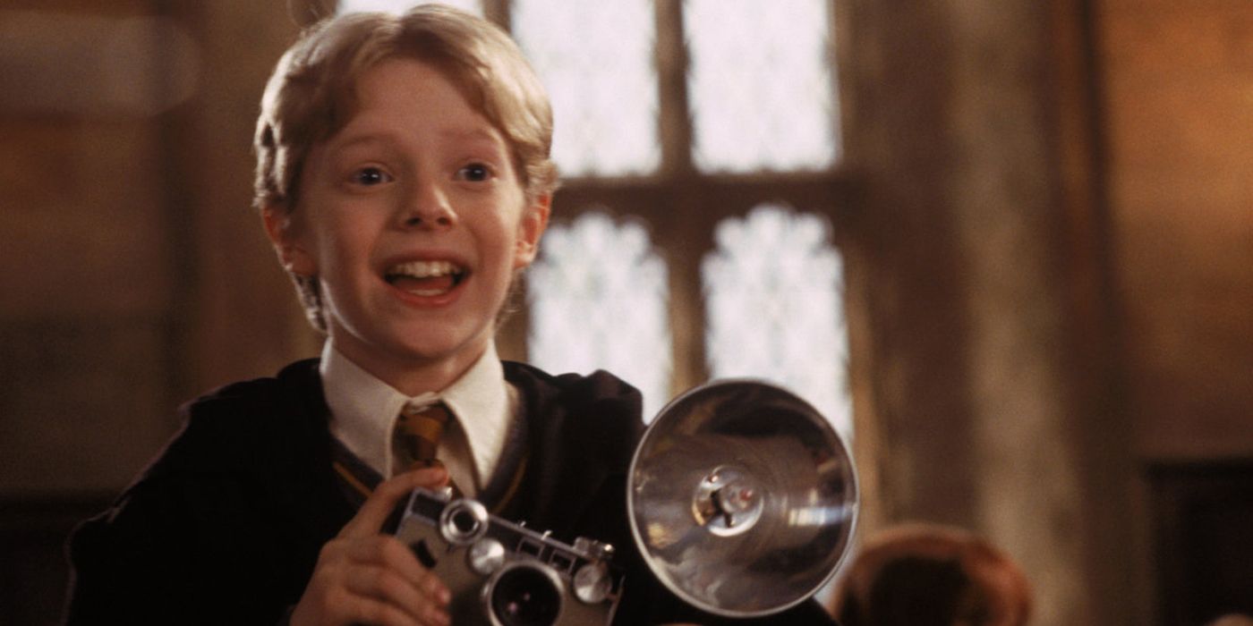 Colin Creevey taking a picture of Harry Potter.
