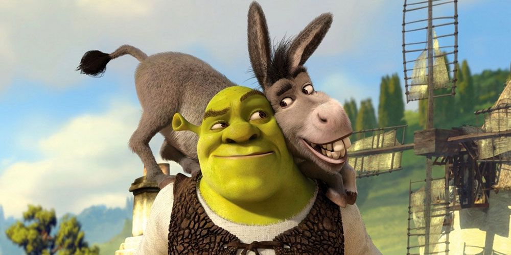 Donkey stands on Shrek’s shoulders in Shrek.