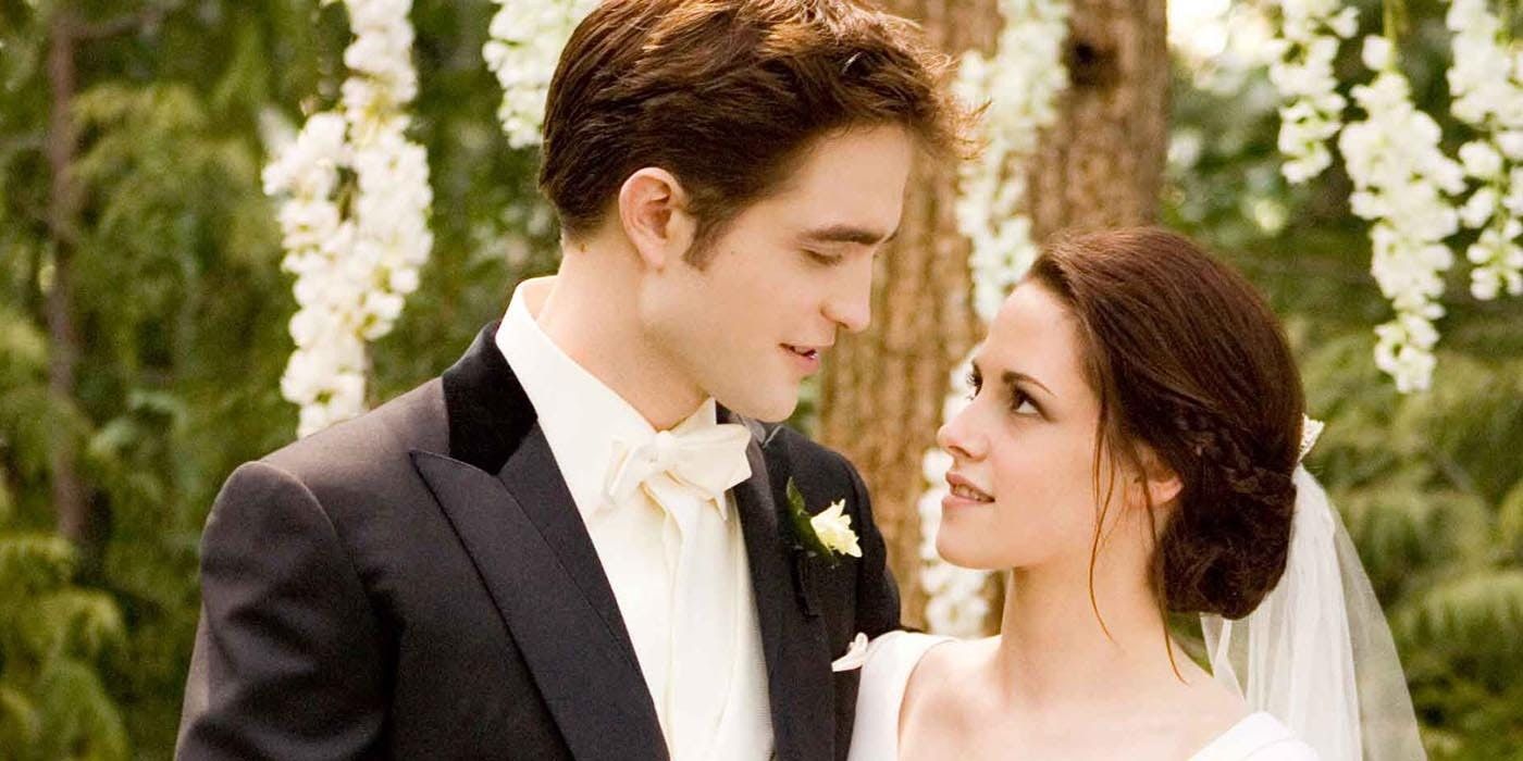 Edward and Bella looking lovingly at each other during their wedding ceremony in Breaking Dawn