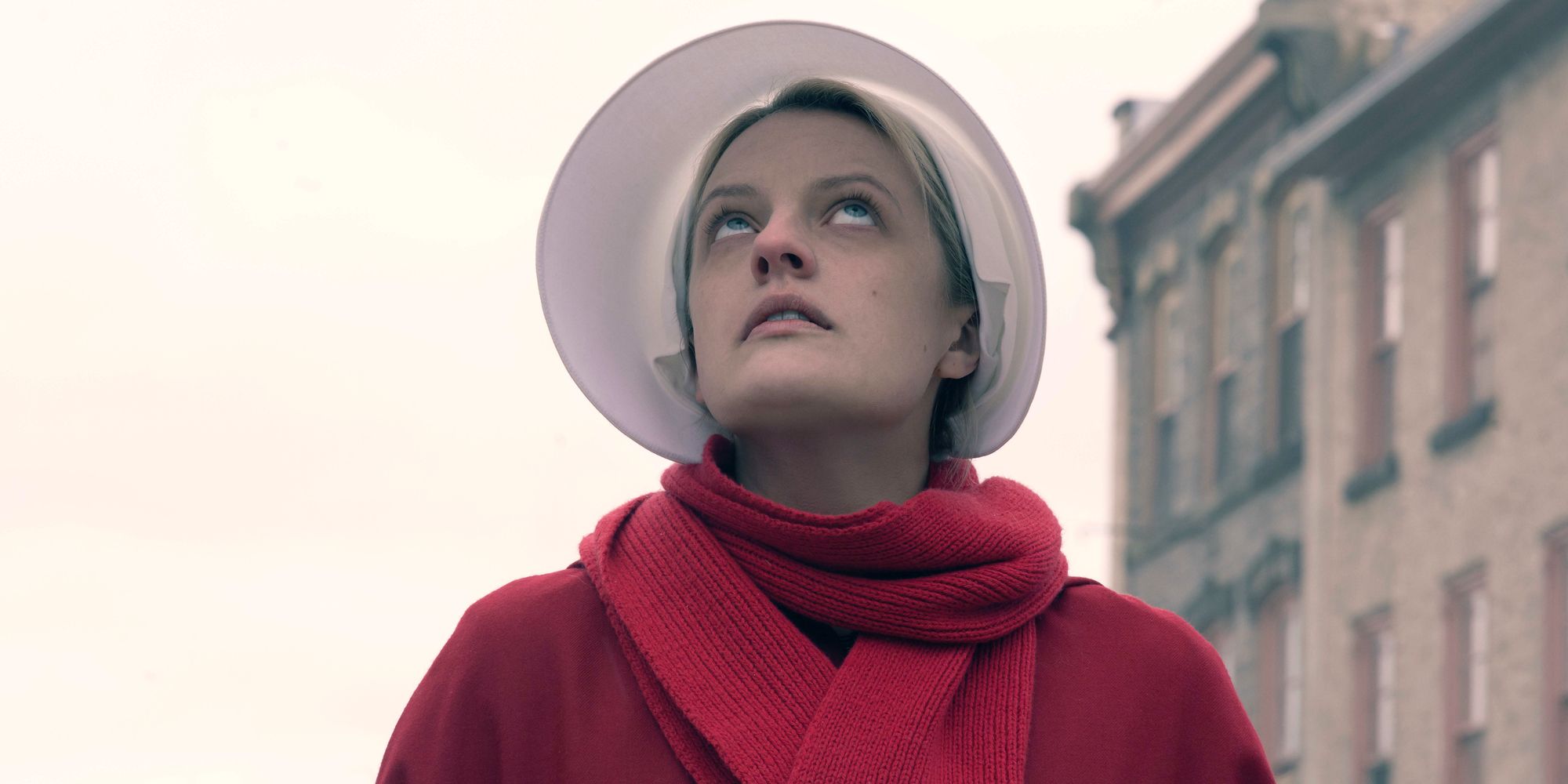 Offred stares at her former friend's apartment in The Handmaid's Tale Season 3 Hulu