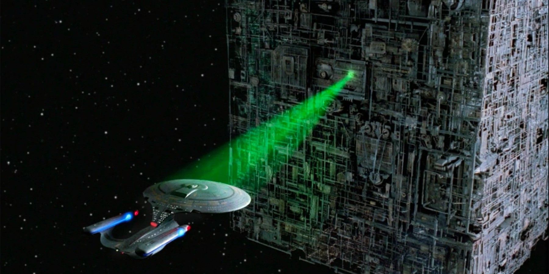 Enterprise in trapped in a beam from the Borg Cube 