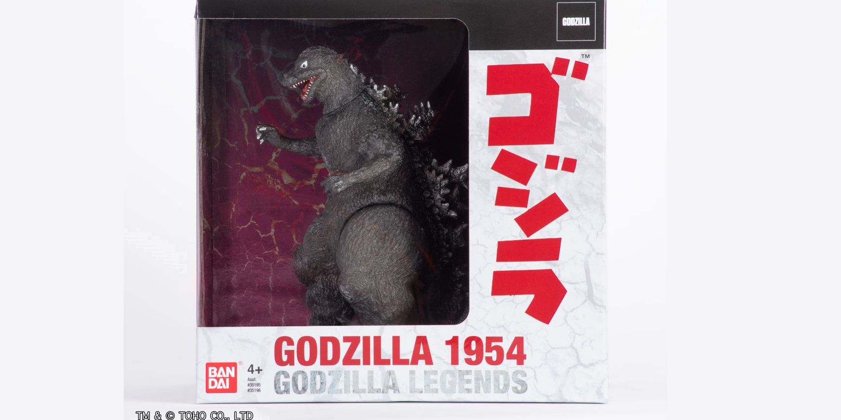 Godzilla SDCC figure stands in box front view