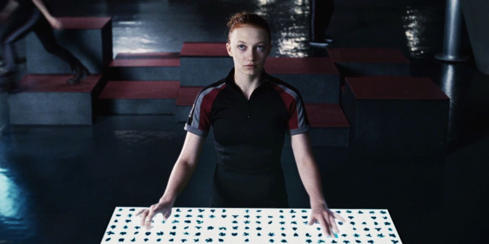 Foxface on a computer in The Hunger Games.