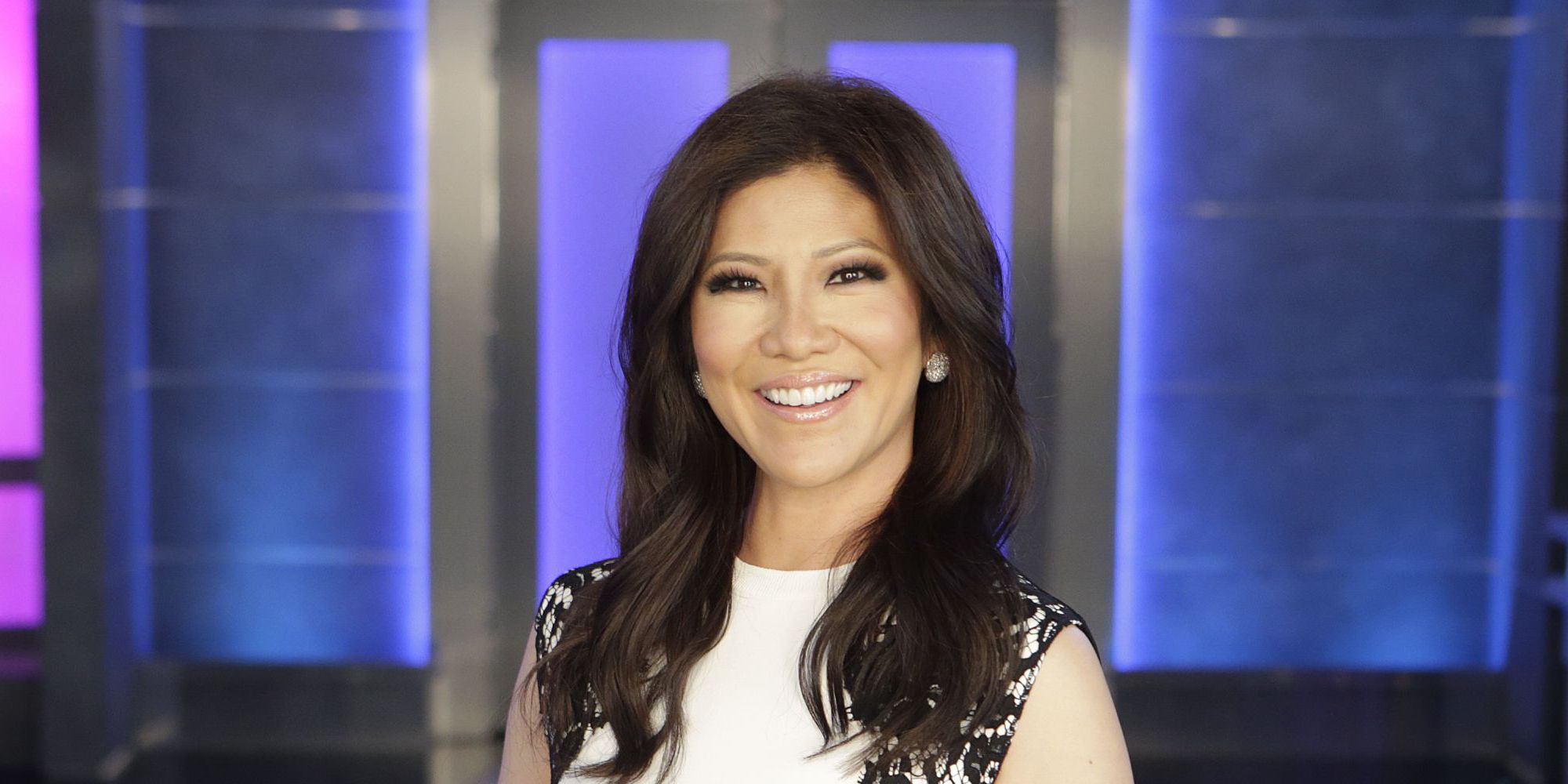 Julie Chen on Big Brother Season 21 smiling in white dress