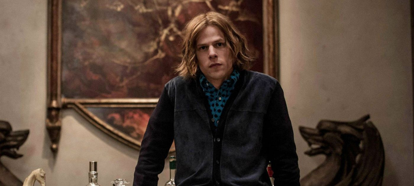 Lex luthor leans on a desk in Batman v Superman.