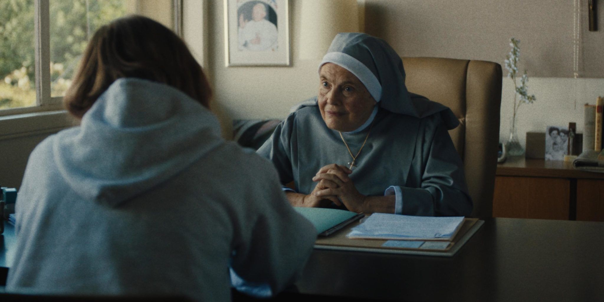 Lois Smith as Sister Sarah Joan taliing to Lady Bird in her office in Lady Bird