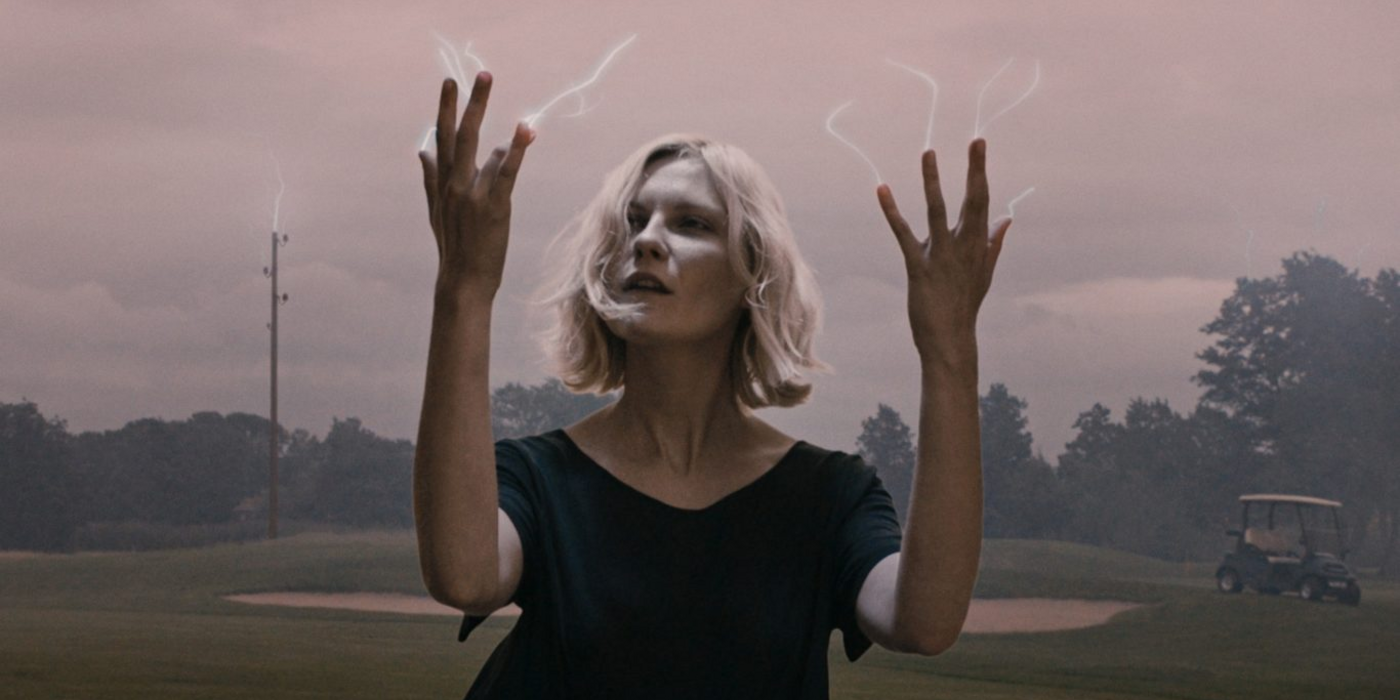 Justine watches her fingers in Melancholia