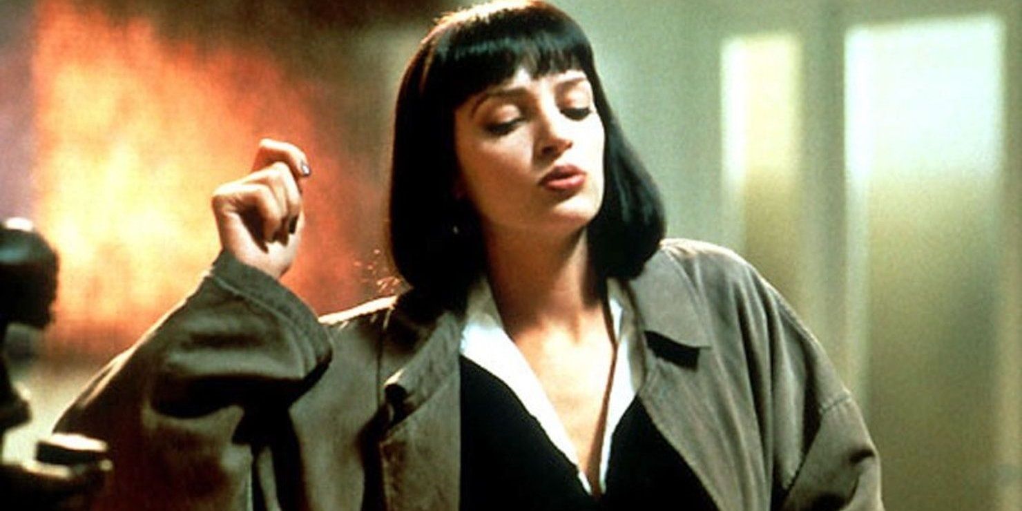 Mia Wallace dancing in Vincent's coat in Pulp Fiction