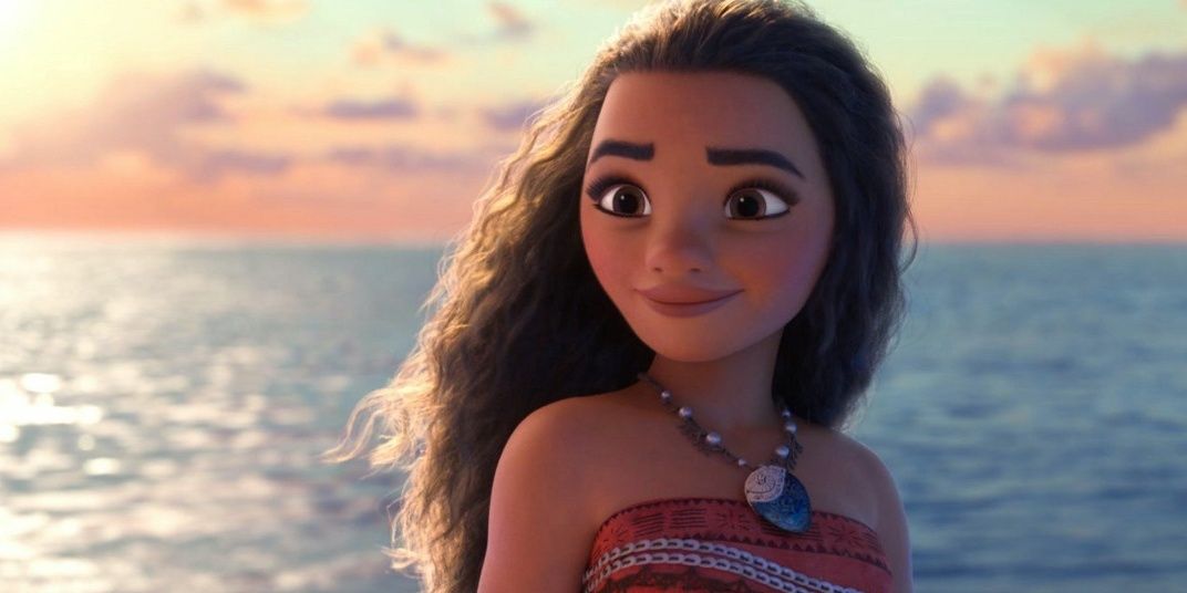 Moana standing in front of the ocean.