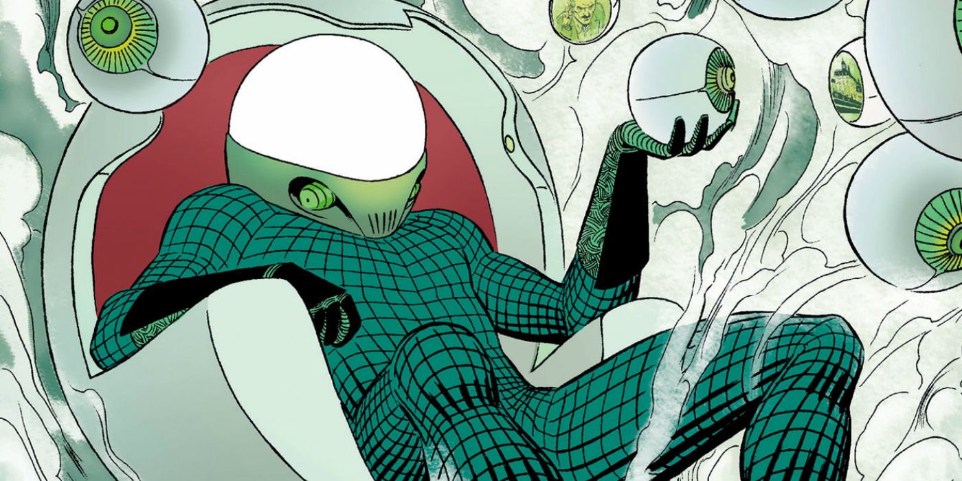 Mysterio sitting on a chair and holding a glass ball