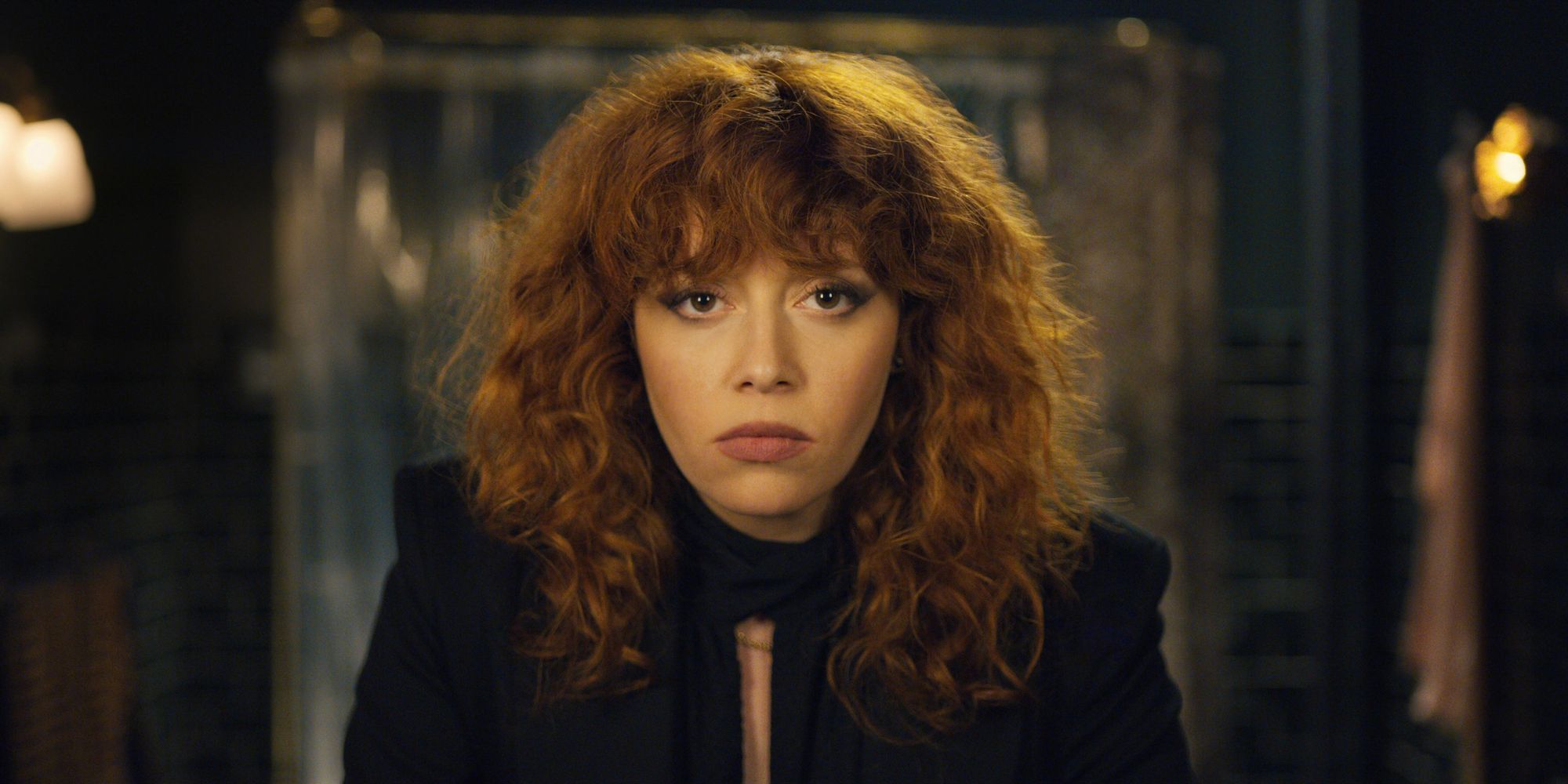 Nadia looking at herself in the mirror in Russian Doll.