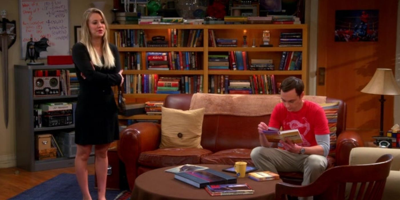 Penny standing next to Sheldon in the apartment on The Big Bang Theory
