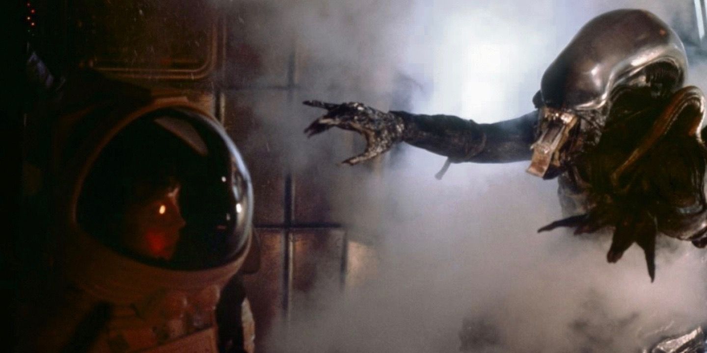 Xenomorph reaching for Ripley in a spacesuit in Alien 1979