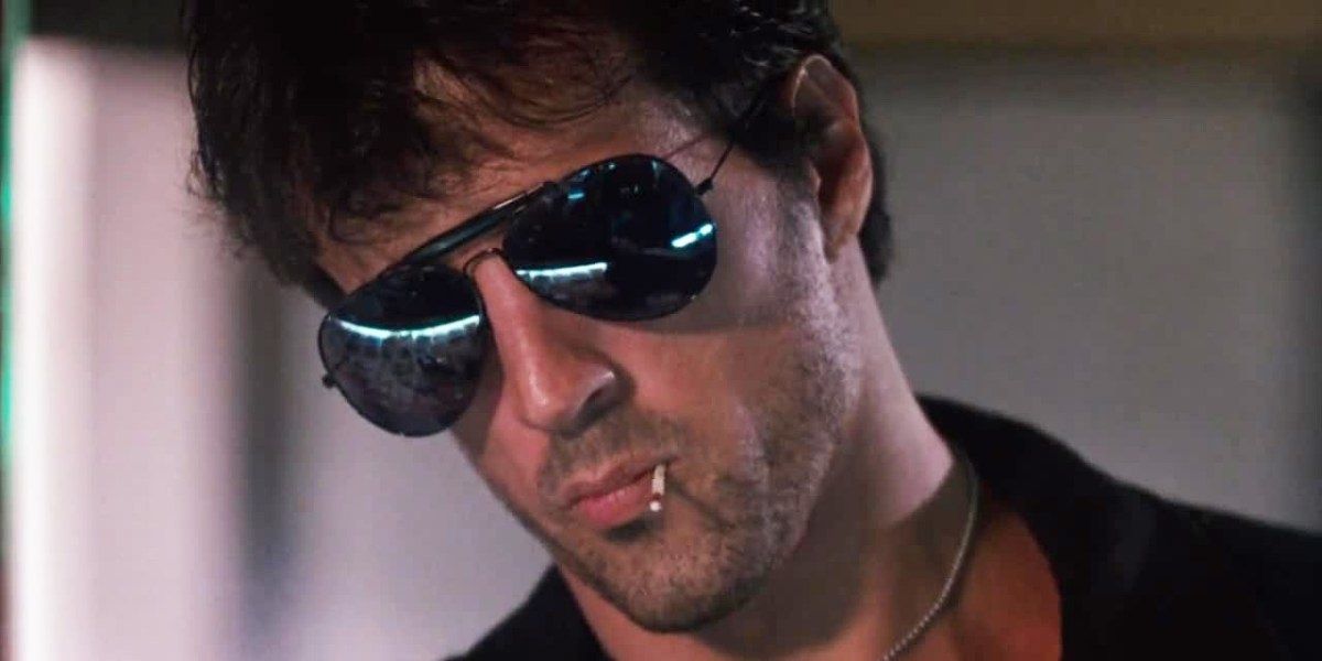 Sylvester Stallone chewing on a toothpick in Cobra