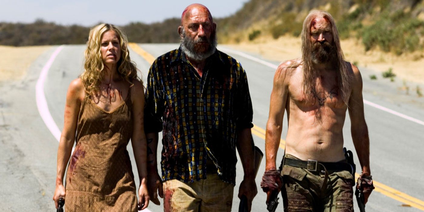 Baby, Otis, and Spaulding walk down a highway in The Devil's Rejects 