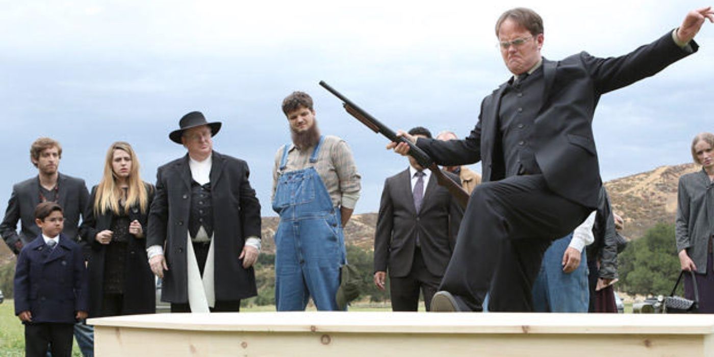 Rainn Wilson kicking the lid off a coffin as Dwight Schrute in The Office season 9