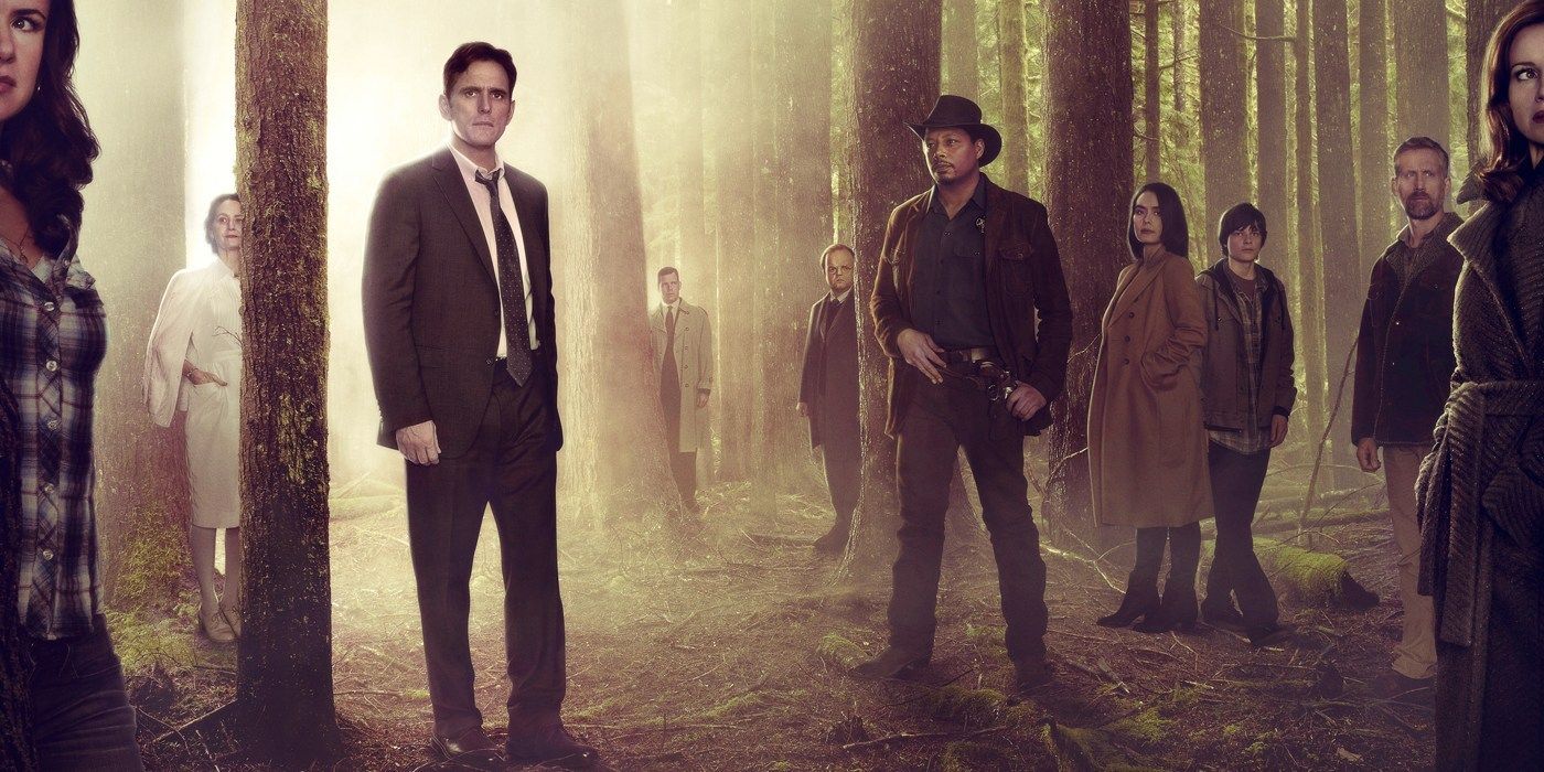 The cast of Wayward Pines standing in a forest