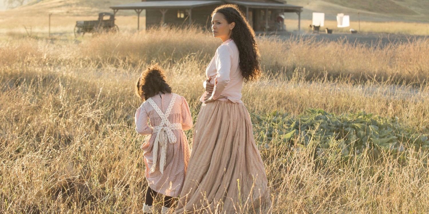 An image of Maeve and her daughter standing in a field of wheat in Westworld