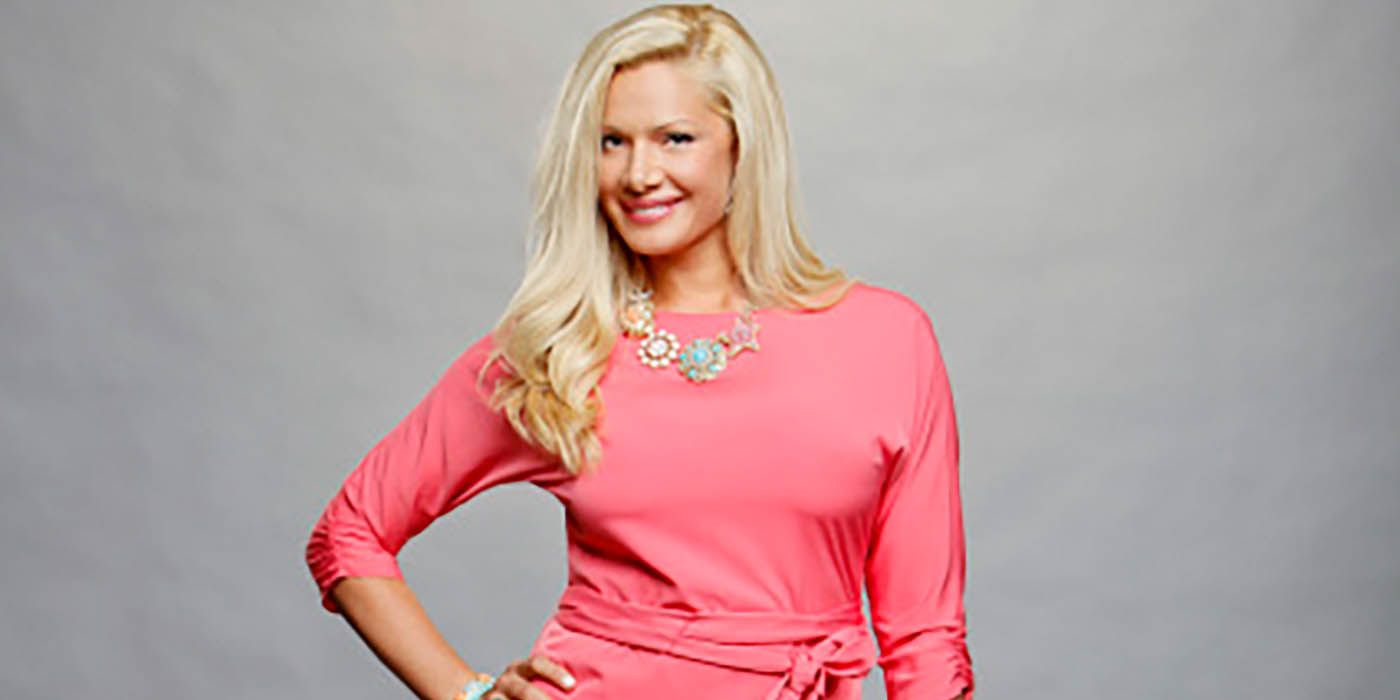 Janelle Pierzina smiling and posing for a promo photo for Big Brother.