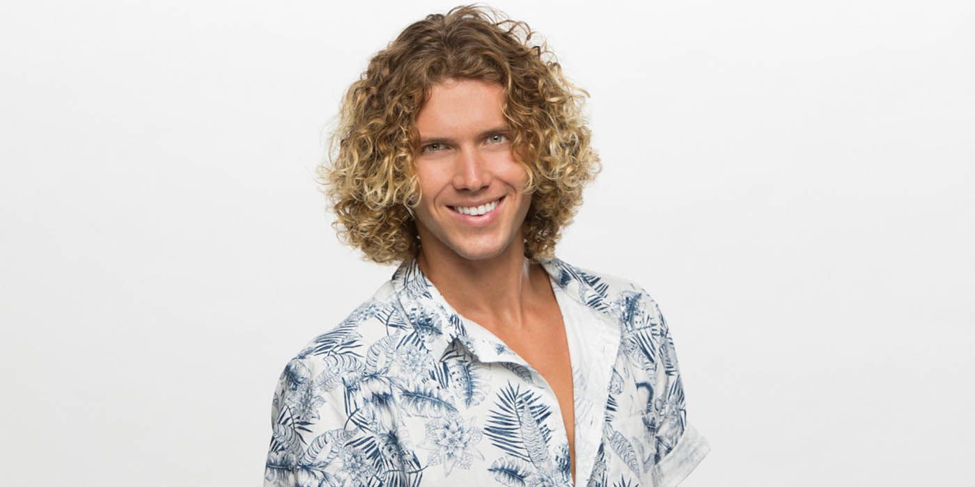 Tyler Crispen smiling for a promo photo for Big Brother