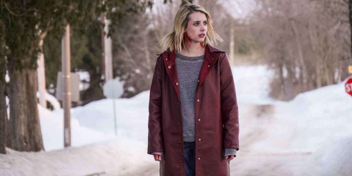 Emma Roberts standing outside in the snow in The Blackcoats Daughter