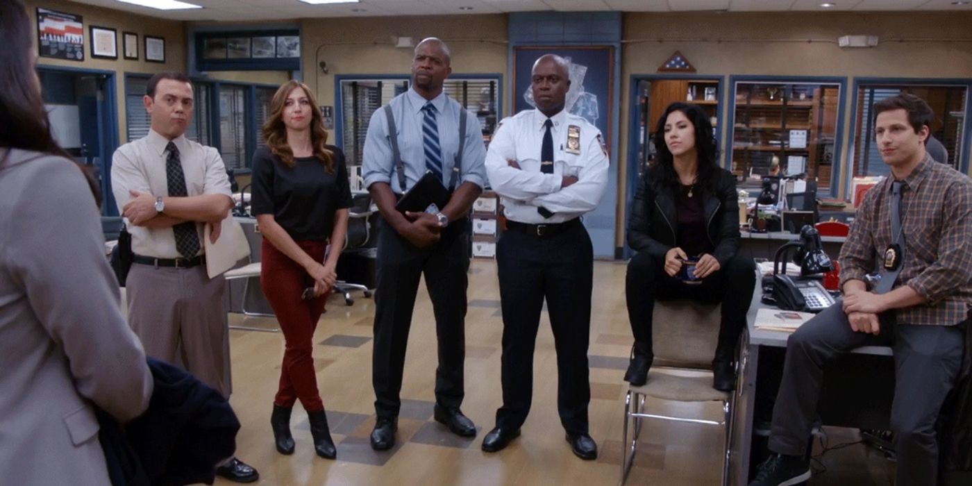 The 99th precinct standing in the bullpen during the Hot Damn! cold open in Brooklyn Nine Nine