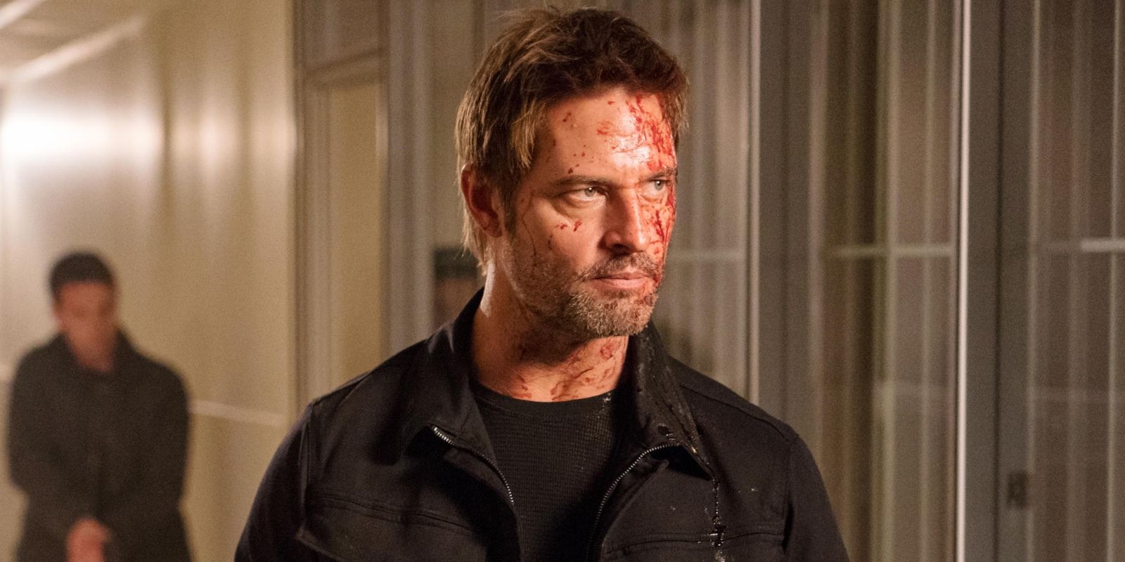 Josh Holloway as Will in Colony season 3, covered in blood and looking stern.