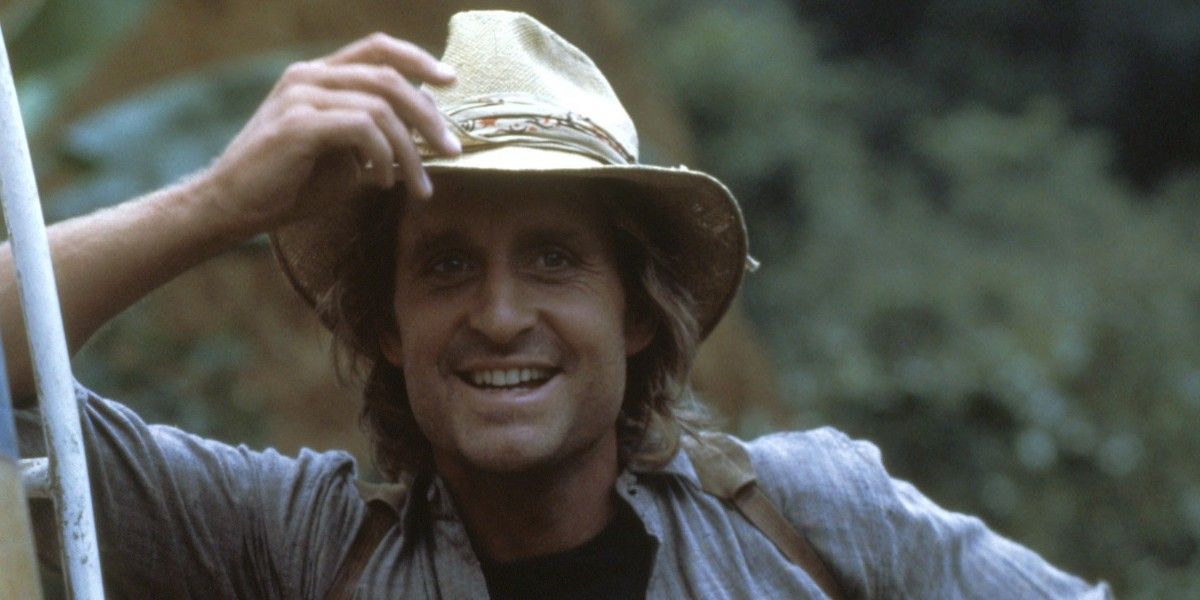 Jack Colton smiling cheekily in Romancing the Stone.